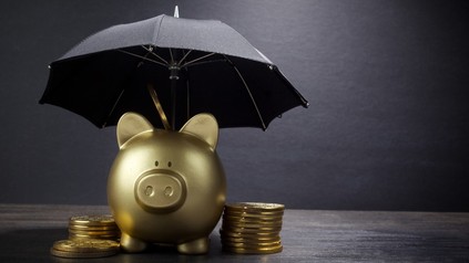 Ein Sparschwein mit Rettungsschirm