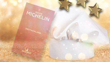 Eine Kochmütze neben einem Michelin-Führer
