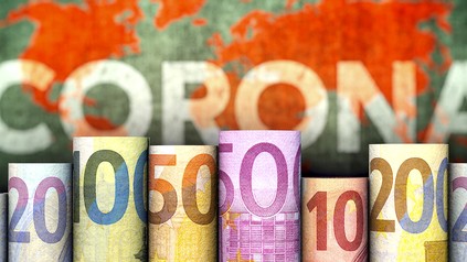 Geld vor ei9nem Corona-Schild