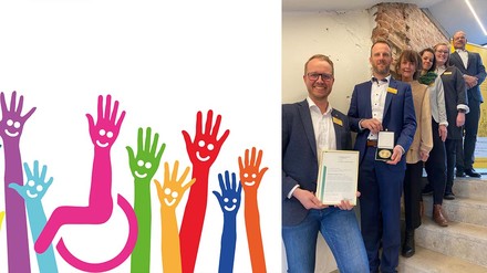 Vorstand und Geschäftsstelle des Verbunds der Embrace-Hotels mit Urkunde und Medaille