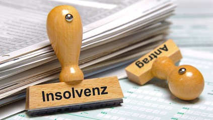Zwei Stempel mit Aufdrucken "Insolvenz" und "Antrag"