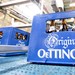 Eine Kiste Oettinger-Bier steht am 31.07.2014 in der Oettinger Brauerei in Braunschweig (Niedersachsen) auf einem Transportband.