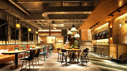 Modern eingerichtetes Café-Restaurant mit Tischen, Stühlen und Barbereich