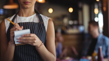 Waitress taking order at restaurant
