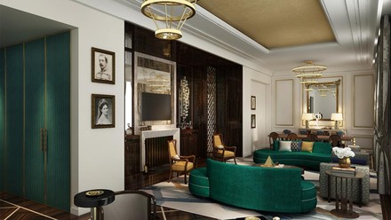 Blick in ein geplantes Hotelzimmer mit grünen Couchen