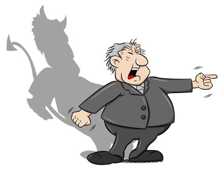 Mann deutet wütend auf jemanden, sein Schatten hat die Form des Teufels