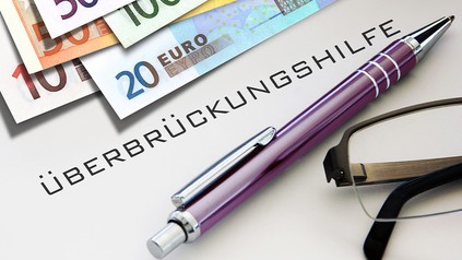 Gefetteter Schriftzug "Überbrückungshilfe"